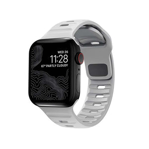 Smartwatch med sort skærm og hvid sportsrem til Apple Watch, elegant og moderne design.